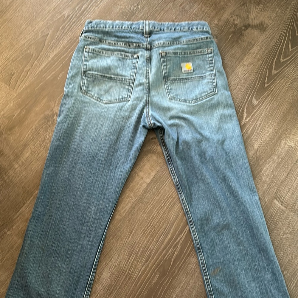 These are a pair of 30x30 carhart blue denim jeans